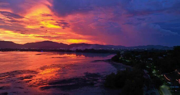 
aerial view reflection of colorful cloud in bright sky of sunset above the ocean at Khao Khad Phuket. 
Majestic sunset or sunrise landscape Amazing light of nature background. 
fantastic sky texture.