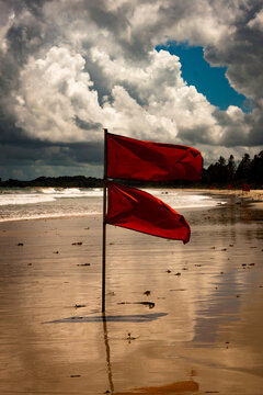 Red flags at the beach in Bintan due to rough waves and storms