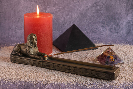Incense holder sphinx, shungite and amethyst pyramids with colored candle