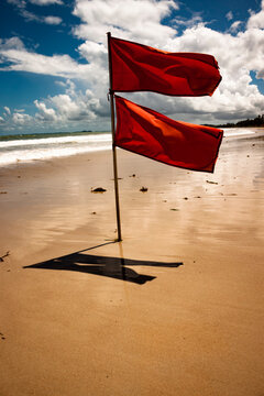 Red flags at the beach in Bintan due to rough waves and storms
