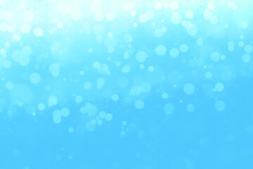 Refreshing defocused background with beautiful round lights scattered on a light blue base