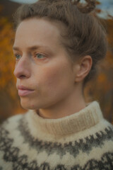 Natural beauty closeup portrait of a woman in knitted sweater