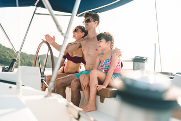 Caucasian couple who man and woman relax fun with luxury party drinking champagne by talking together while catamaran yacht boat sailing. Happy and enjoy outdoor lifestyle on summer vacation travel