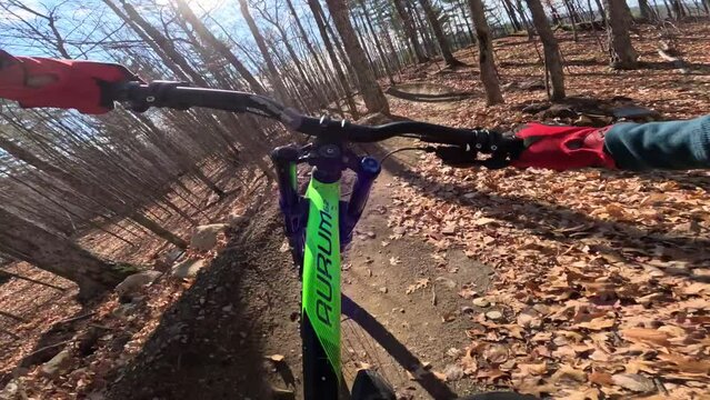 mtb pov rider in action packed trail twisty turns and cool jumps sunny autumn day