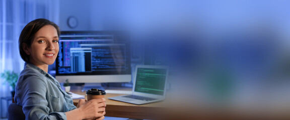 Female programmer in office at night. Banner for design