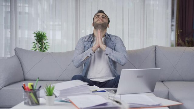 Entrepreneur man praying while doing business.