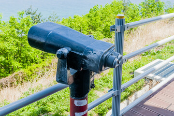 Viewing binoculars at Korean observation tower.