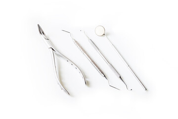 Close up of dental instrument or equipment isolated on white clean background inside dental clinic in hospital.Dental mouth mirror,Gigival separator and probe for toothache or Orthodontic.