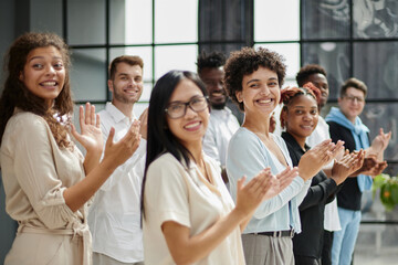 Obraz premium High angle view of multiethnic people cheering after a seminar