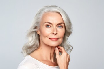 Beautiful gorgeous 50s mid aged mature woman looking at camera isolated on white. Mature old lady close up portrait. Healthy face skin care beauty, middle age skincare cosmetics. Generative AI - obrazy, fototapety, plakaty