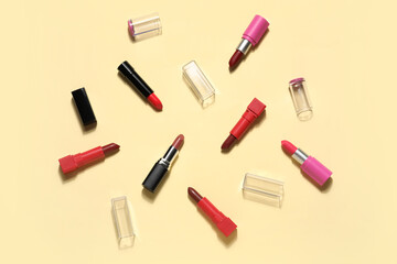 Different lipsticks on yellow background