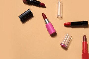 Obraz premium Different lipsticks on beige background