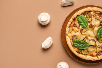 Fototapeta na wymiar Mushroom pie with spinach leaves and champignons on brown background
