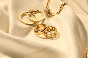 Beautiful jewellery on white fabric background