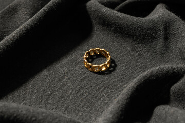Beautiful ring on black fabric background