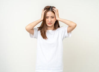 Obraz na płótnie Canvas Young asian beautiful woman hand touching head she's feeling depressed stress headache be tired from working standing on isolated white background she has symptom office syndrome.