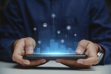 Businessman holding smartphone with Smart city, Smart services and icons, internet of things.