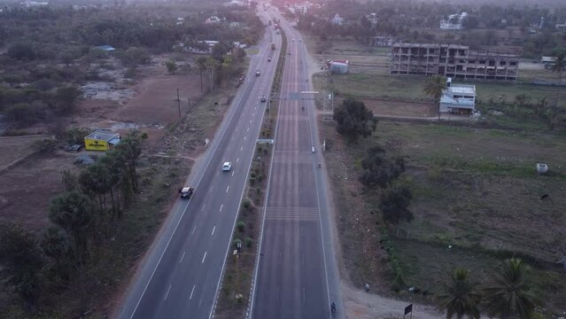 Static aerial view of Mumbai Pune Bangalore Highway at Sunset near Davangere in Karnataka, India