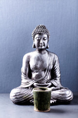 Meditating Buddha Statue. Soft focus. Copy space.