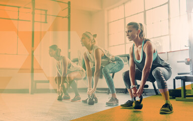 Kettlebell, fitness and women group at gym for exercise, workout and training in class. Athlete women together in row for power challenge, commitment or strong muscle at a wellness club with overlay