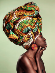 Beauty, profile and black woman in head wrap in studio for culture, glow and cosmetics on green...