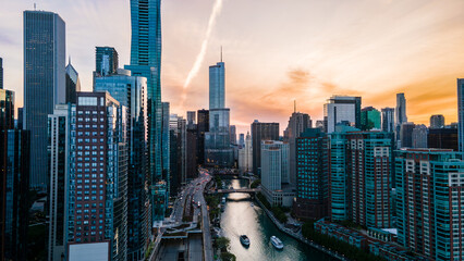 Chicago IL USA May 4th 2023: aerial drone shot of Chicago downtown metropolitan area during sunset over the lake. the city architecture relates to business travel, urban life and finance 