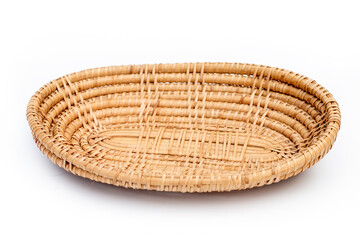 Small flat wicker basket isolated white background