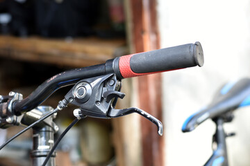 Part of a bicycle handlebar close-up.