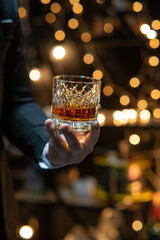 Barman pouring whiskey whiskey glass beautiful night