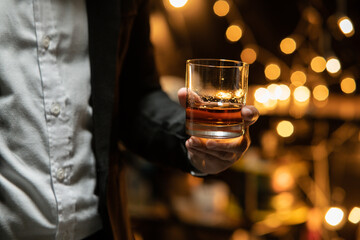 Barman pouring whiskey whiskey glass beautiful night