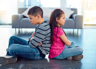 Angry, brother and sister in home living room, fighting or argument, conflict or problem. Anger,...