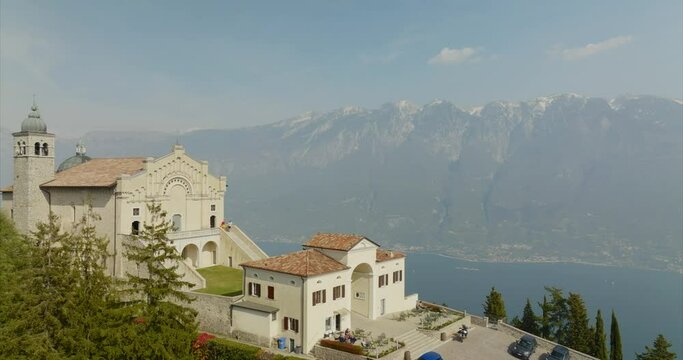 Aerial orbiting over Tignale Montecastello shrine on Lake Garda in Lombardy, Italy