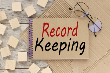 record keeping text on craft notepad on craft background. business concept. education concept.