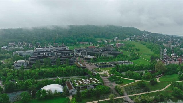 Aerial view of City of Z&uuml;rich with University Campus Irchel on a cloudy spring morning. Movie shot May 9th, 2023, Zurich, Switzerland.