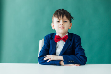 boy sitting at a desk at a school education knowledge school