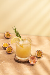 Passion fruit lemonade. Wooden spoons. Shadows from the sun. Summer drink. Passion fruit.