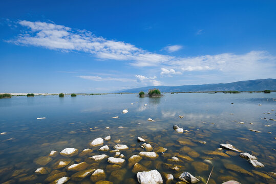 Lake Karla, calm and beautiful lake, Greece, a unique wetland, with water changes, small islands and aquatic plants and birds.