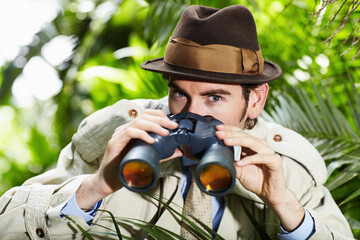 Detective man, search and portrait in jungle with vintage gear for investigation and solution....