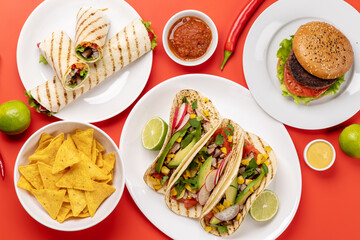 Mexican food featuring tacos, burritos, nachos
