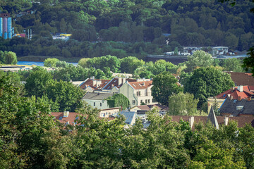 Fototapeta na wymiar View on a city part with lots of summer greenery and residential ouses in Kaunas, Lithuania
