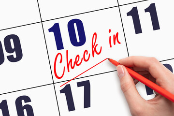 10th day of the month. Hand writing CHECK IN and drawing a line on calendar date.