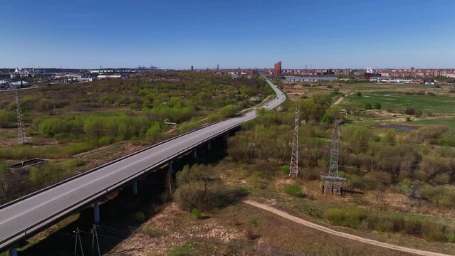 Aerial view of the road used by transport and trucks driving to and from the city.