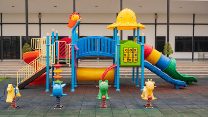 Children playground on yard activities in the school.Outdoor play equipment for kindergarten...