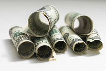 a role-dollar bills in front of white background