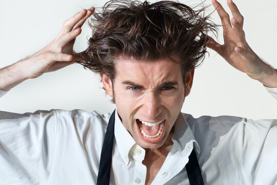 Crazy, Scream And Portrait Of Business Man On White Background With Stress, Frustrated And Anger. Mental Health, Depression And Face Of Male Worker Shouting, Stressed Out And Messy Hair In Studio