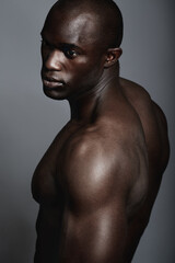 Art, aesthetic and beauty, black man on dark background with muscle and fitness, strong and serious...