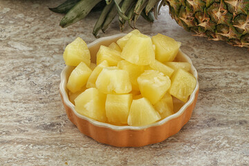 Marinated pineapple slices in the bowl