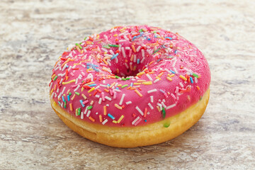 Sweet glazed struwberry donut with icing