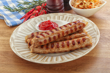 Grilled sausages with cabbage and sauce