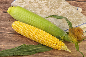 Yellow sweet raw cob corn